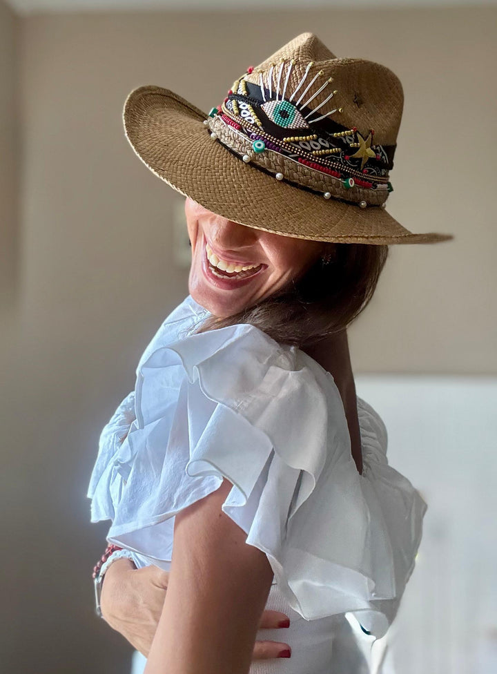 Luxury summer fashion featuring handmade Colombian straw hat with evil eye details and western boho aesthetic by Bootsologie