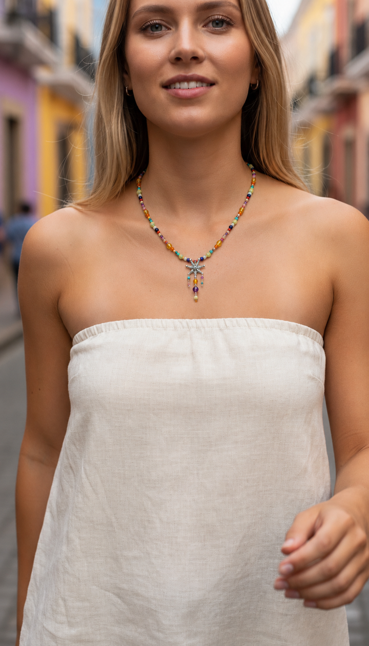 Woman wearing colorful Mexican piñata gemstone necklace by Bootsologie