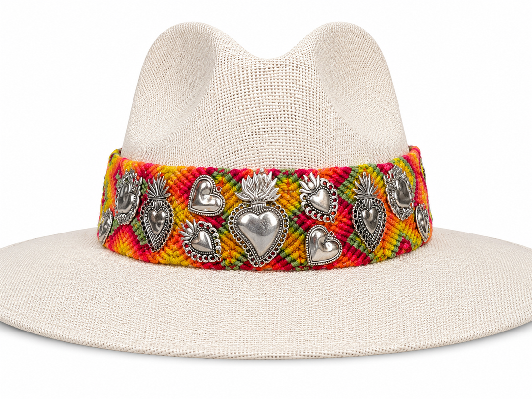 Cream wide brim straw sun hat with Oaxacan textile band and Milagros-style heart accents