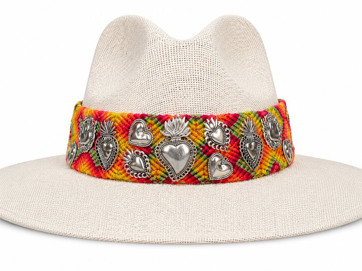 Cream wide brim straw sun hat with Oaxacan textile band and Milagros-style heart accents