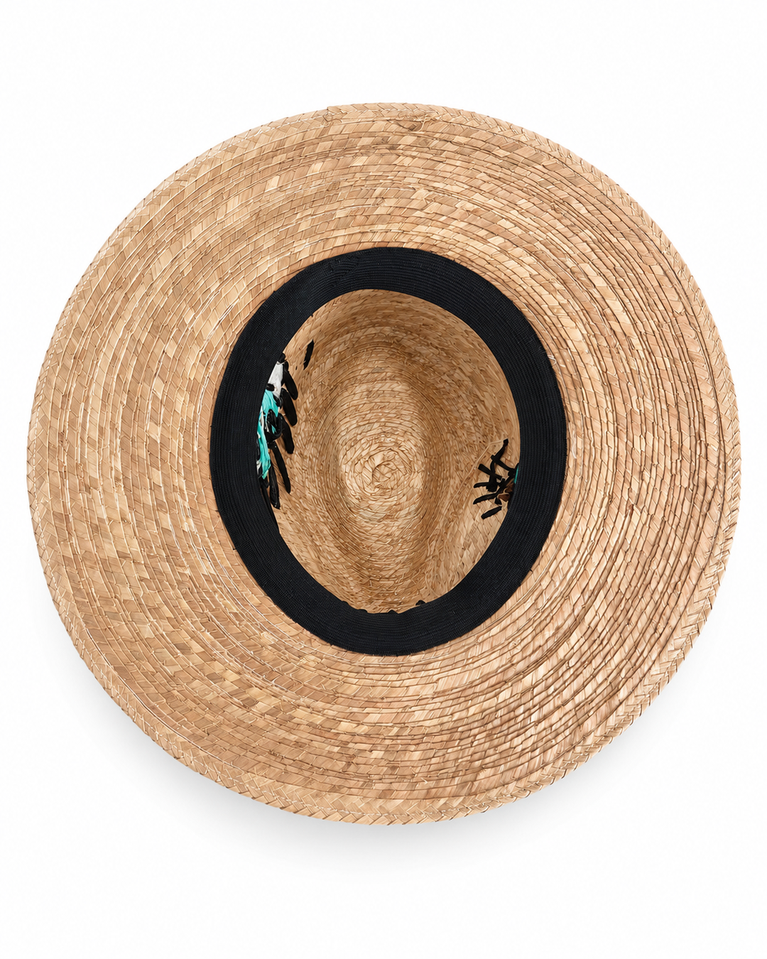 Interior view of handmade straw sun hat with black elastic band and woven straw texture