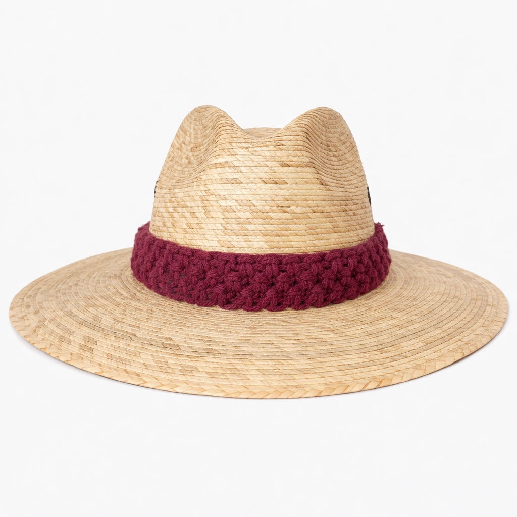 Natural straw sun hat with textured macrame band, stylish boho beach hat with wide brim summer accessory by Bootsologie on white background