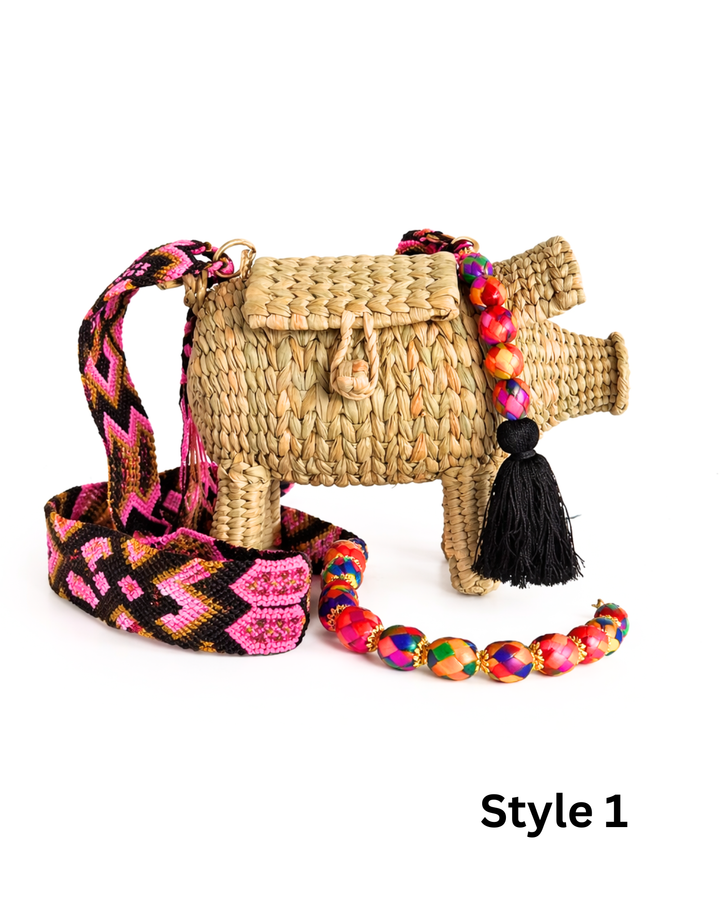 Colorful pig straw handbag with double strap design, top handle and crossbody strap on clean white background