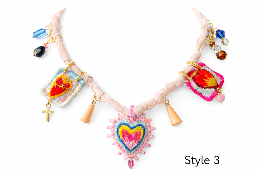 Handmade embroidered heart necklace with Mexican Milagro symbolism and boho artisan style