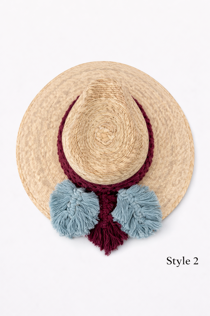 Bohemian straw sun hat with handwoven macrame band and tassels, lightweight summer beach hat by Bootsologie on white background