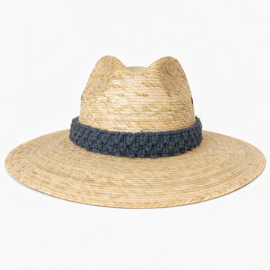 Wide brim straw hat with handcrafted macrame band detail, resort style summer hat for women by Bootsologie on white background