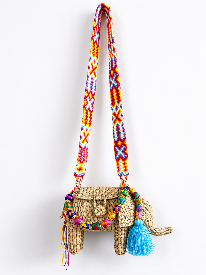 Colorful elephant straw handbag with double strap design, top handle and crossbody strap on clean white background