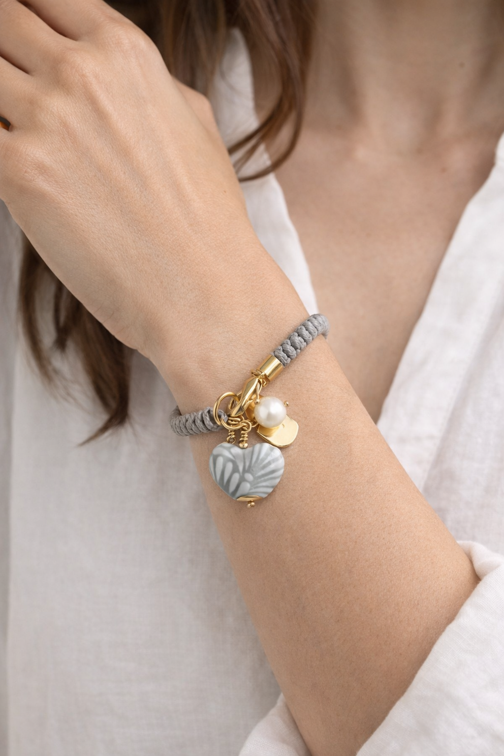 Close-up of Talavera heart bracelet showing painted ceramic detail and genuine freshwater pearl