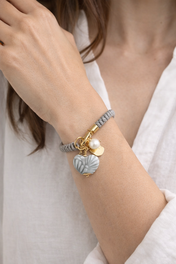 Close-up of Talavera heart bracelet showing painted ceramic detail and genuine freshwater pearl