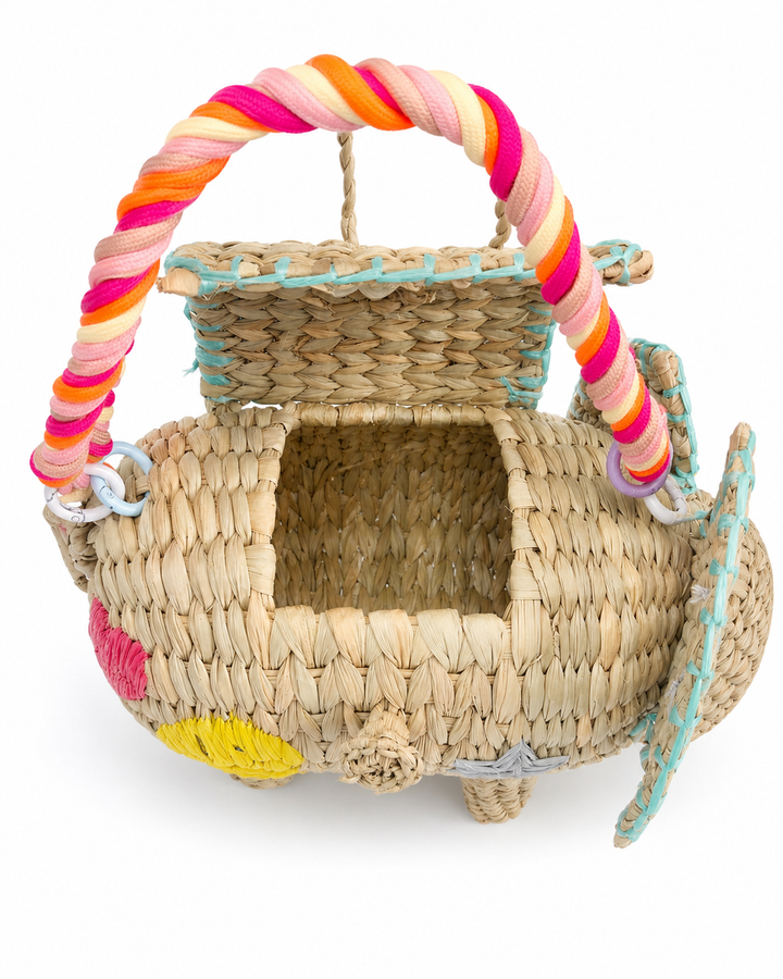Open interior view of elephant straw clutch showing woven construction and compact bag opening.