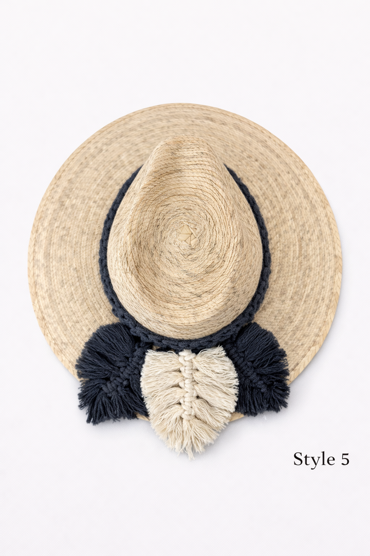 Natural woven straw hat with boho macrame band, wide brim summer sun hat by Bootsologie on white background