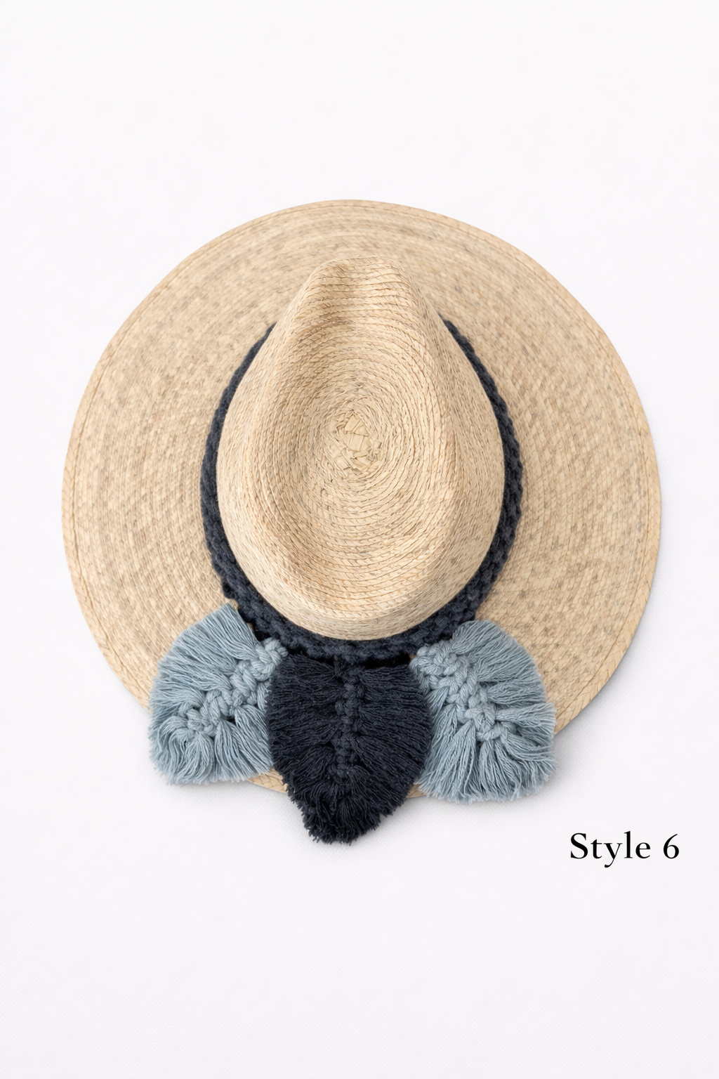 Wide brim straw sun hat with textured macrame band, lightweight boho beach hat by Bootsologie on white background