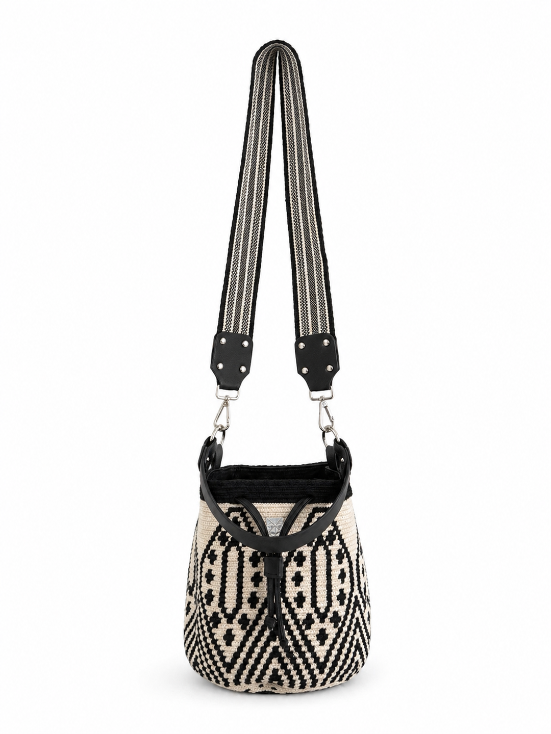     Black and cream woven bucket bag with geometric pattern and wide striped strap on white background Bootsologie