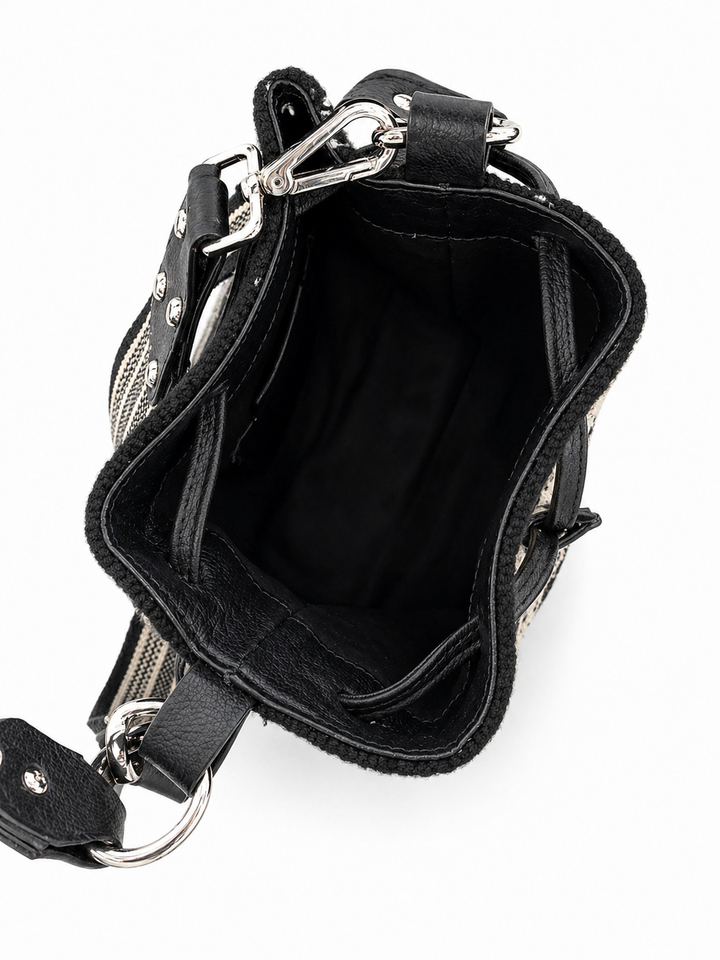 Interior of woven bucket bag showing black lining spacious compartment and leather drawstring closure Bootsologie