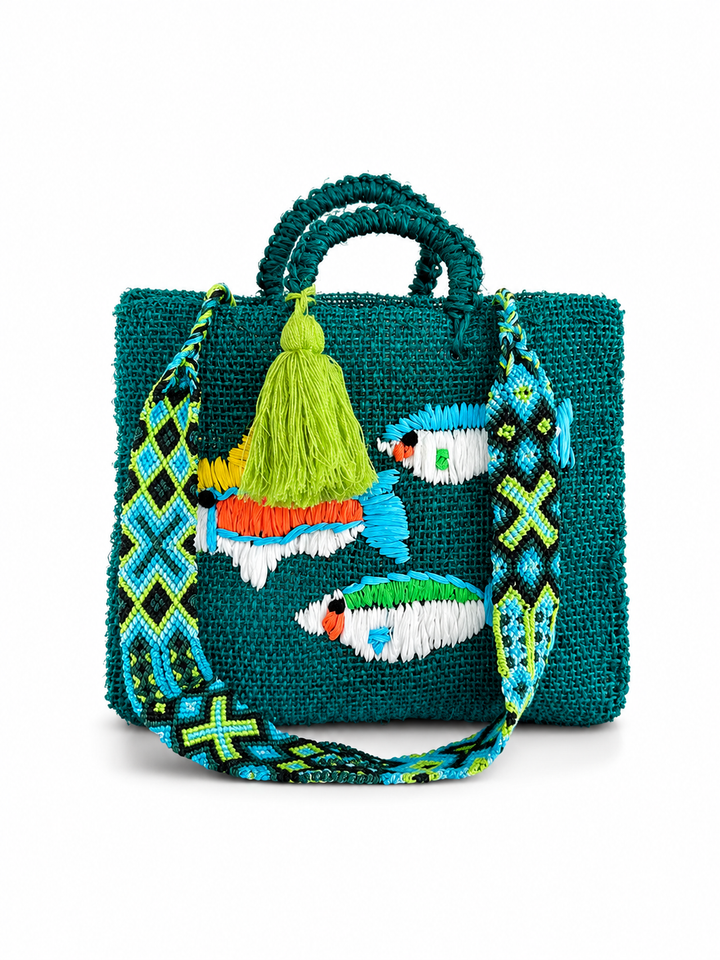 Mexican artisan beach tote bag with embroidered fish design, woven shoulder strap and top handles on white background