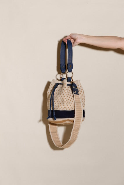 Handwoven Wayuu bag front view neutral colors double strap artisan crossbody Bootsologie