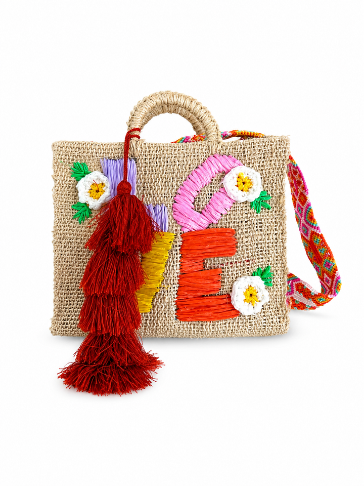 Close-up of colorful LOVE embroidery, flowers and woven ixtle texture on Mexican artisan tote bag