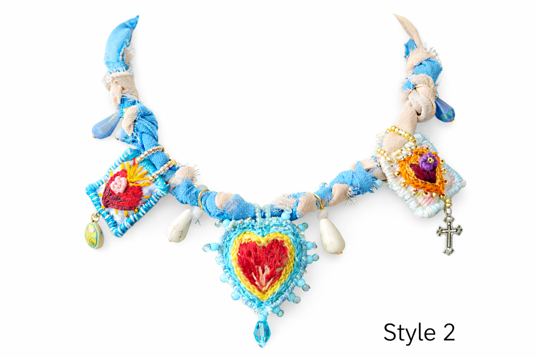 Statement Sacred Heart necklace with colorful embroidered hearts, beads, and folk art details