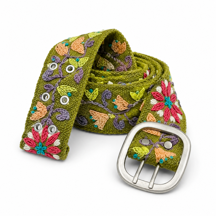 Olive green Peruvian embroidered wool belt with colorful raised floral stitching and aged silver buckle on white background.