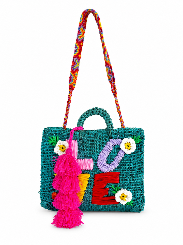 Teal woven LOVE tote bag handmade in Mexico with bright raffia letters and floral accents