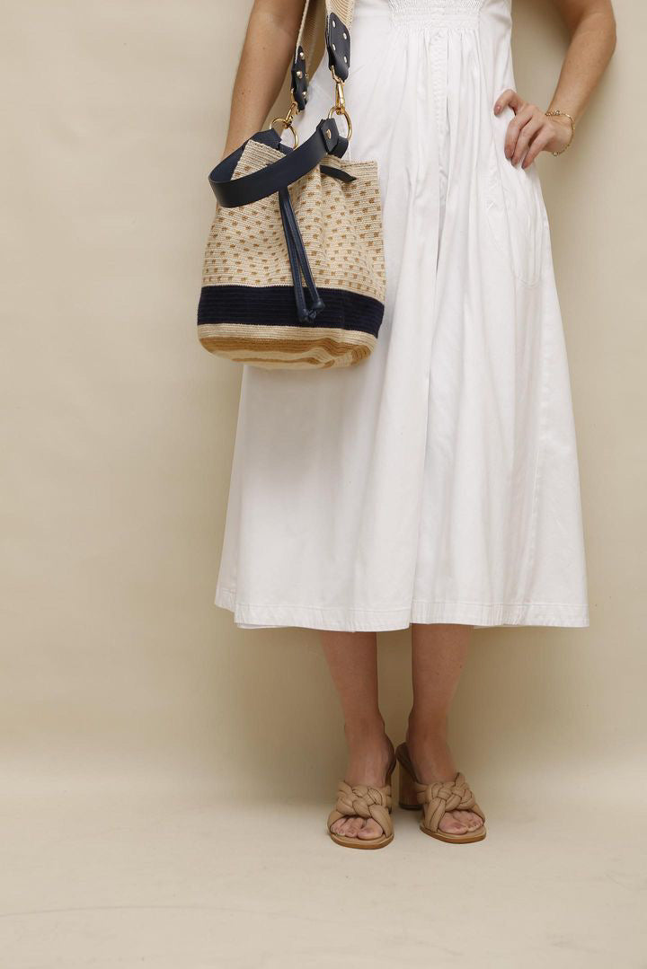 Wayuu bag worn crossbody on model neutral outfit artisan mochila Bootsologie