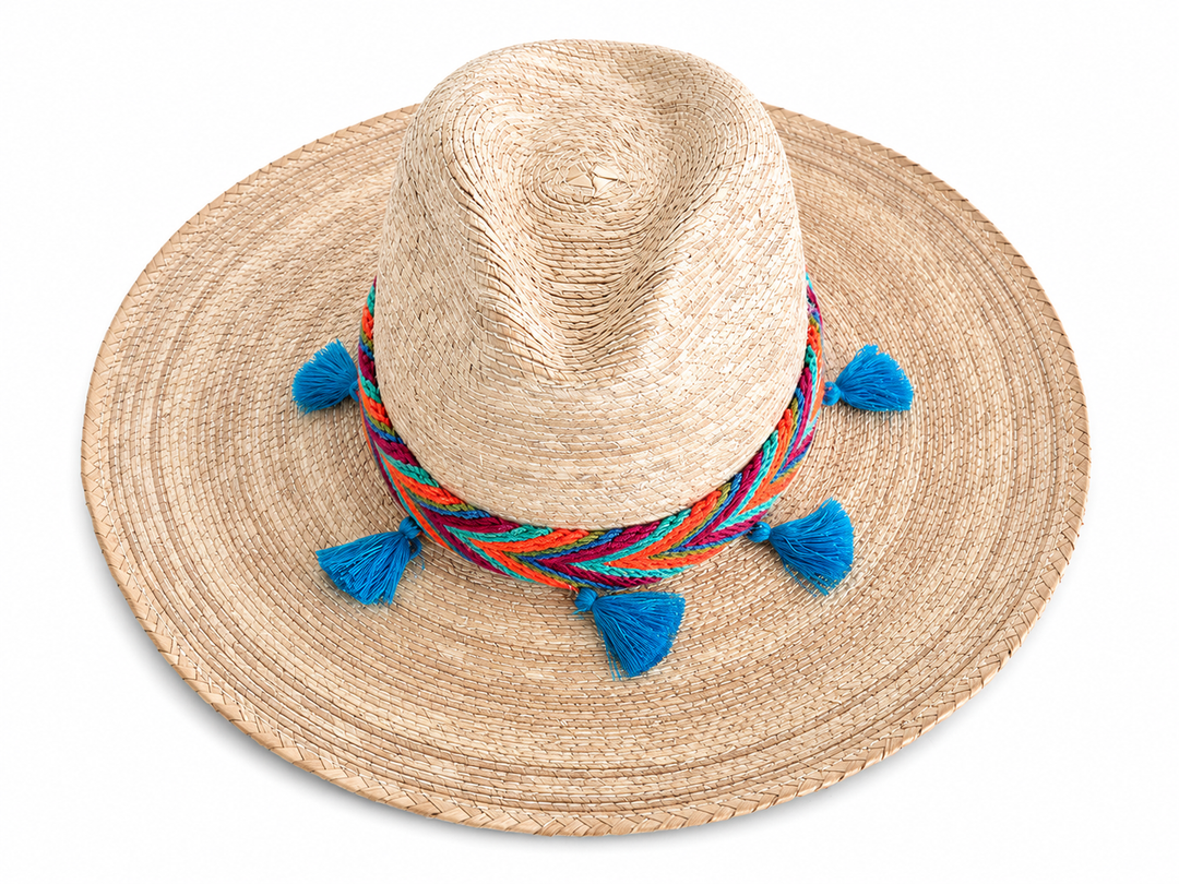 Boho Colombian straw hat with natural woven texture, colorful band, and blue tassels
