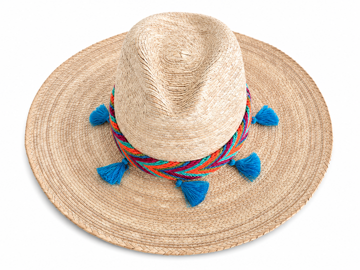 Boho Colombian straw hat with natural woven texture, colorful band, and blue tassels