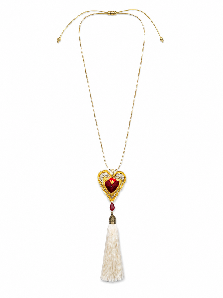 Colorful floral sacred heart necklace with green beaded necklace and dangling bead tassels on white background