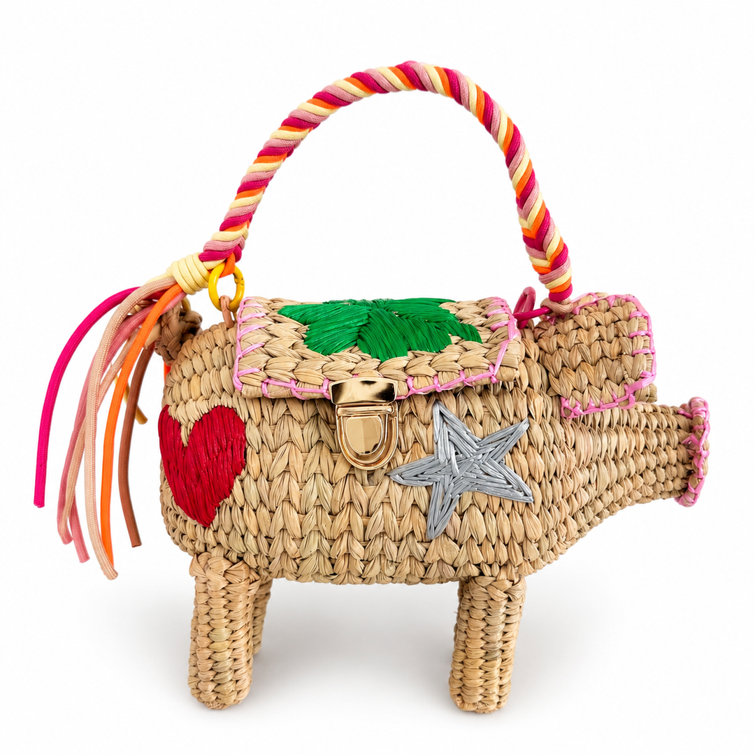 Hand embroidered pig straw bag clutch with colorful braided handle and woven animal silhouette on white background.