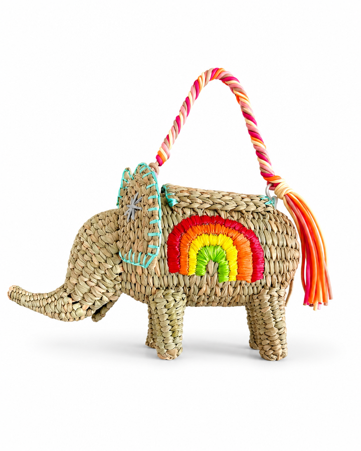 Back view of handmade woven elephant clutch showing natural straw texture and colorful decorative finish.