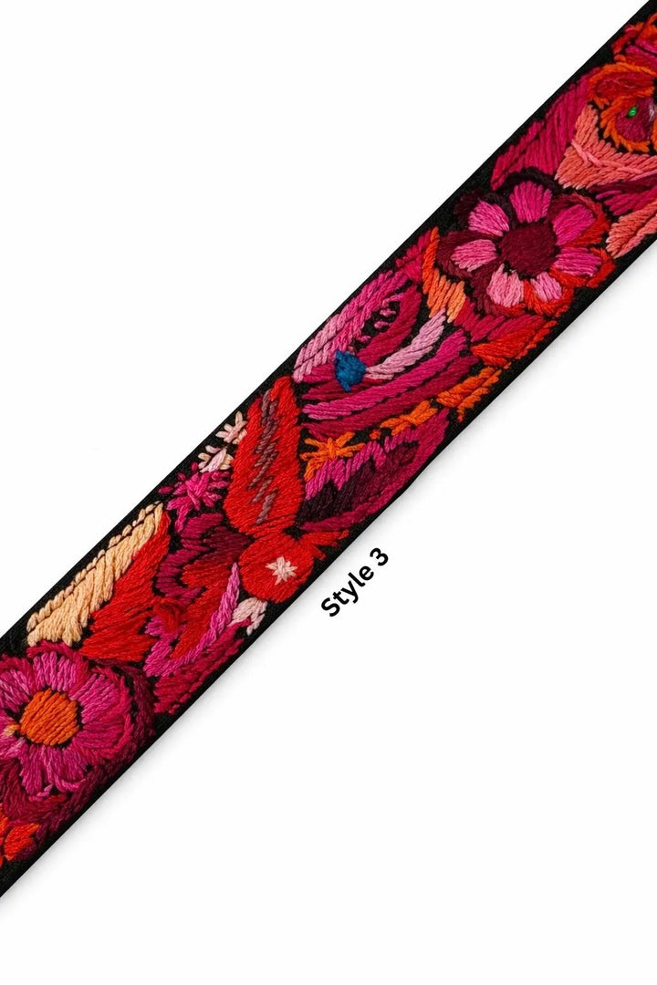 Close up of Guatemalan woven textile strap vibrant colors handmade artisan craftsmanship leather details Bootsologie