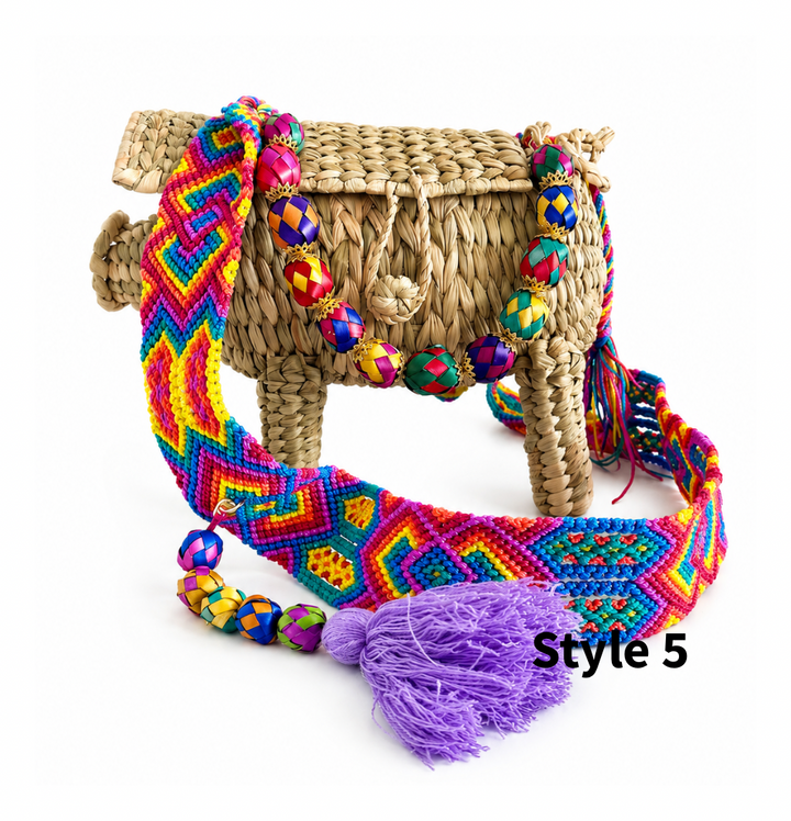 Woven pig shaped purse with natural straw texture, multicolor decorative detail and long crossbody strap