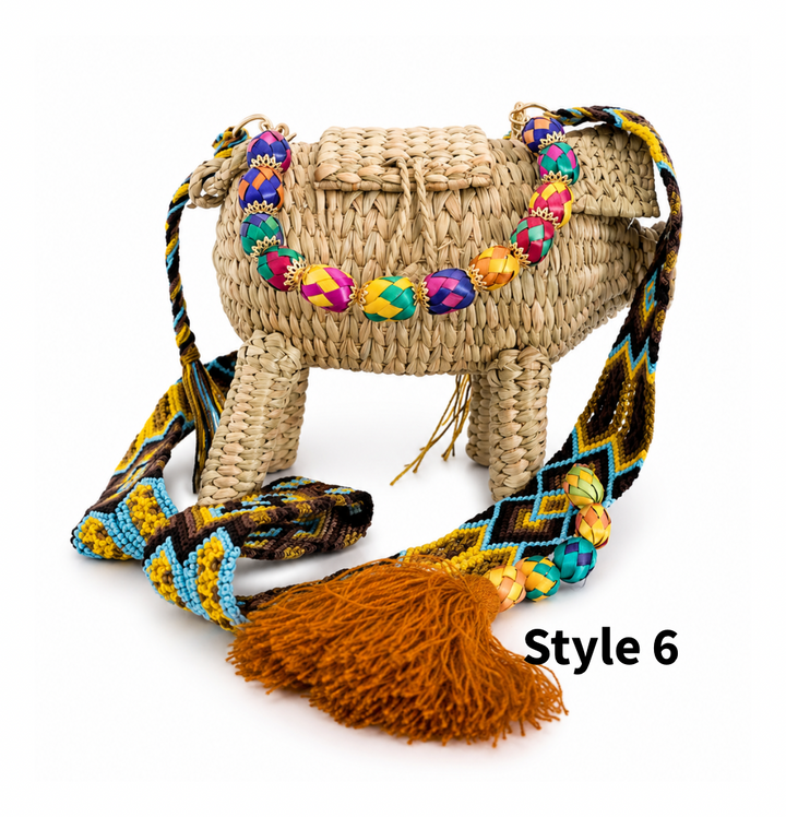 Close up of handmade woven pig bag showing natural straw texture, colorful beads and artisan-style details