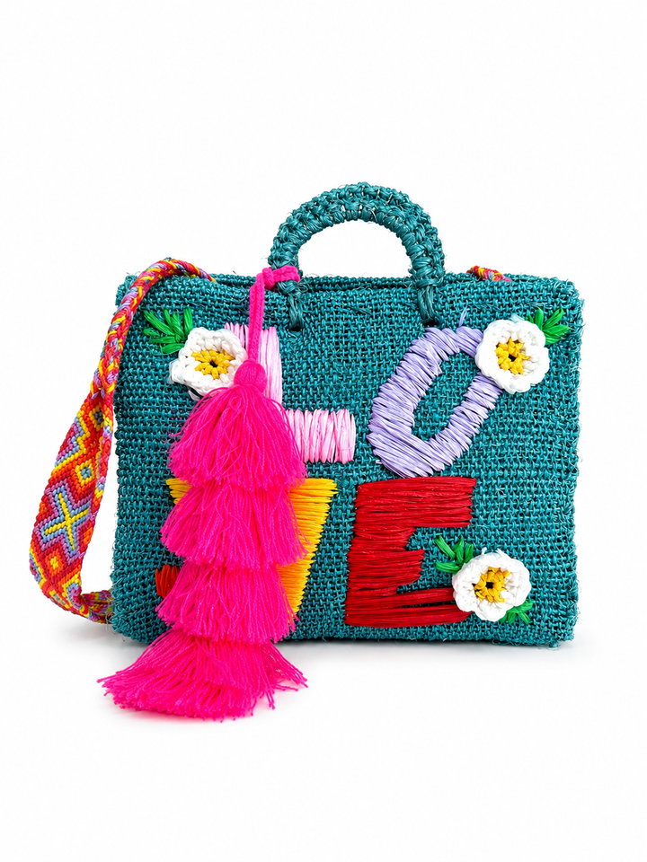 Close-up of colorful LOVE embroidery, flowers and woven ixtle texture on Mexican artisan tote bag