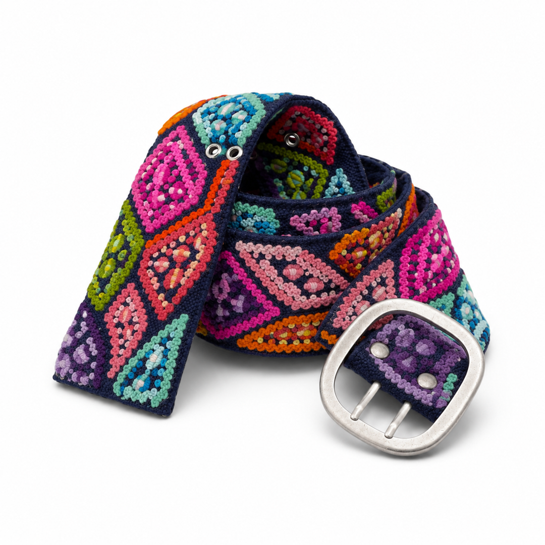 Navy Peruvian embroidered wool belt with colorful raised stitching and silver buckle on white background.