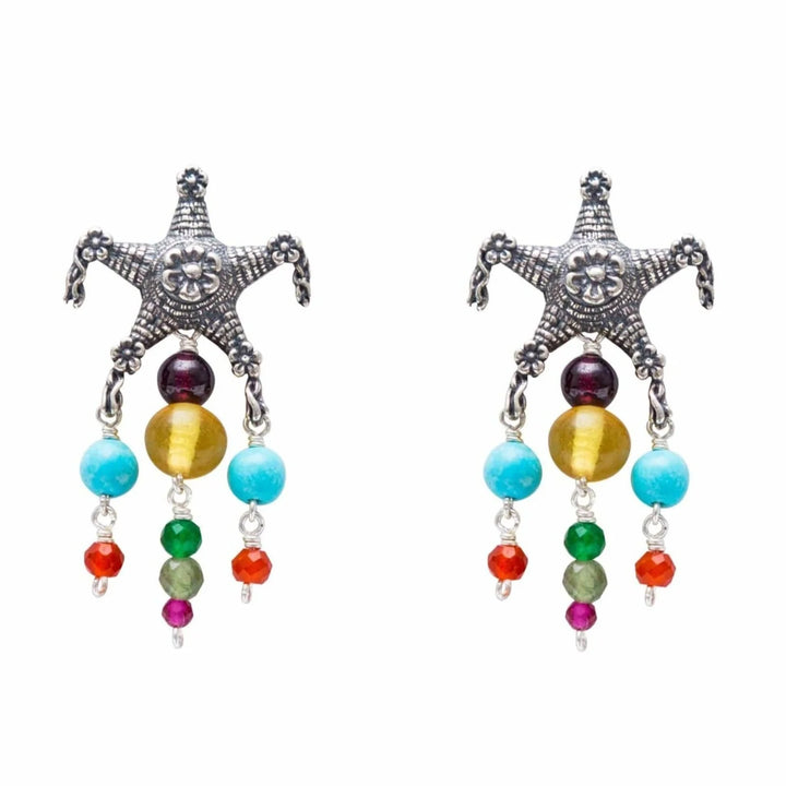 Handmade Mexican piñata silver earrings on white background