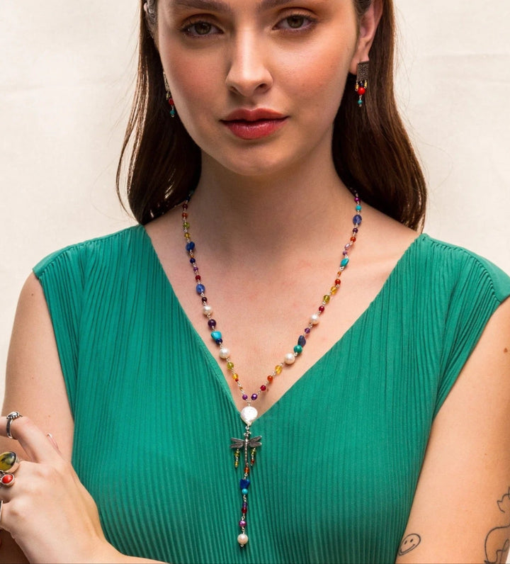 Woman wearing colorful Mexican silver dragonfly gemstone necklace by Bootsologie