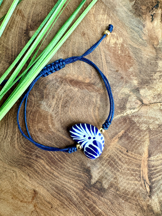Handmade Talavera Heart Shaped Bracelet in Silky Blue Cord from Puebla, Mexico.