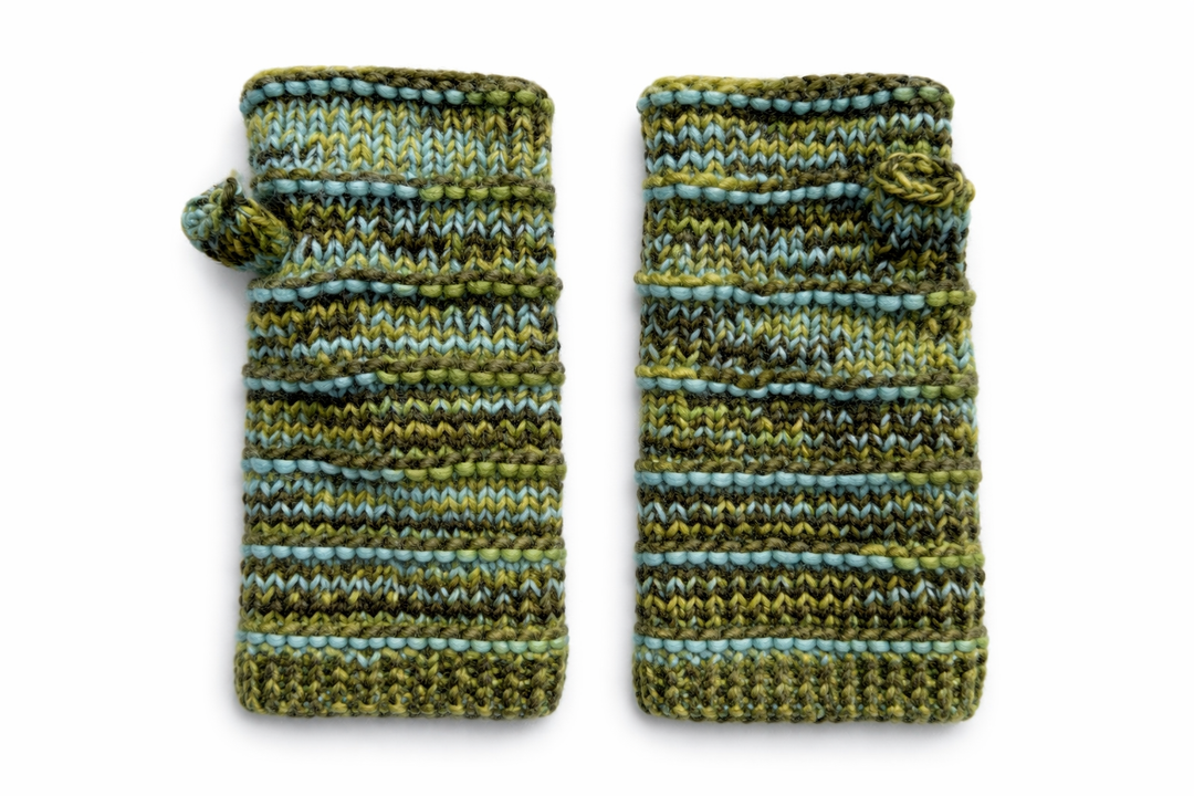 Green ribbed wool fingerless mittens with embroidered detail on white background