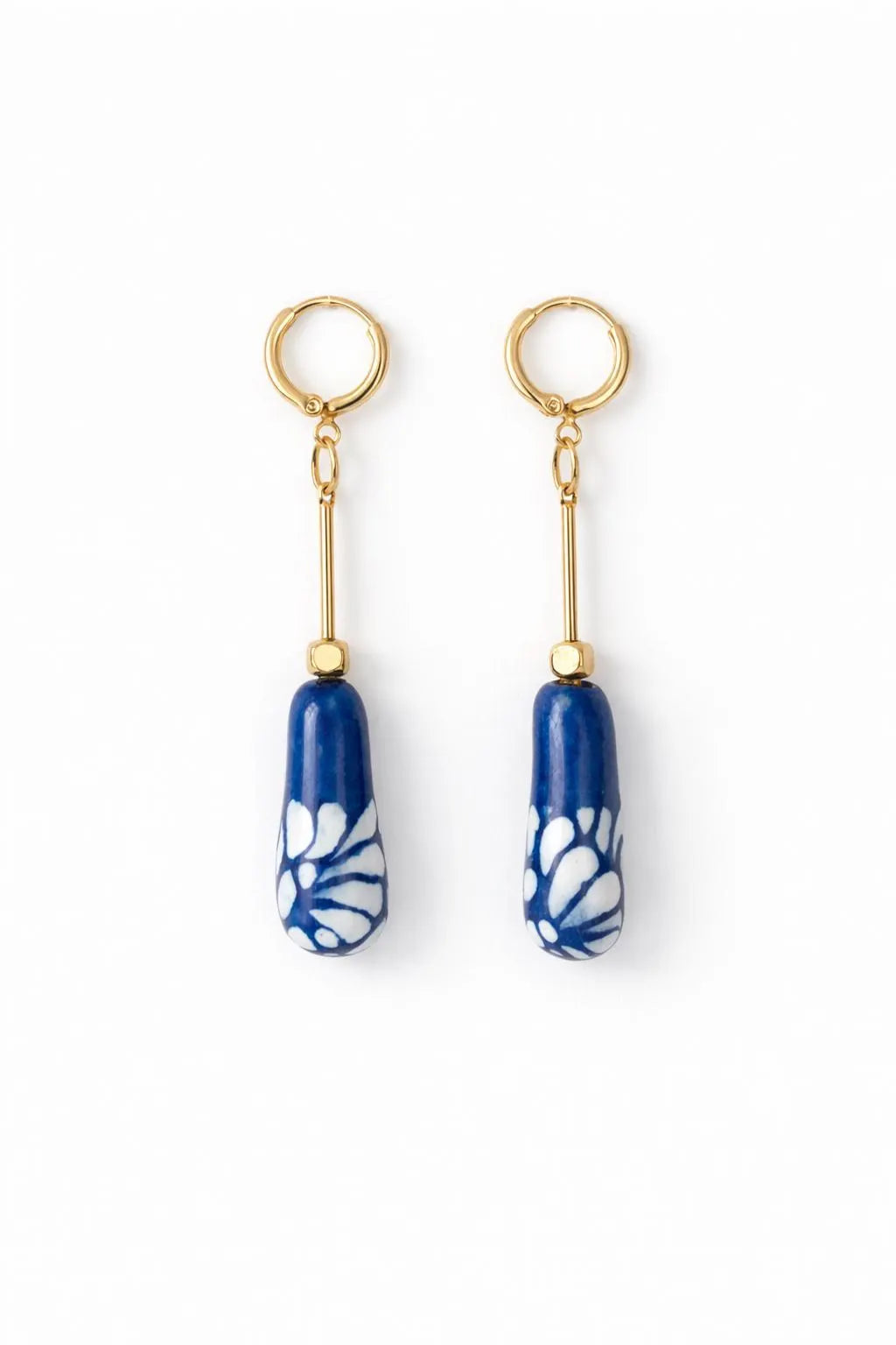 Blue and white Mexican Talavera ceramic drop earrings with gold plated brass hoops on white background