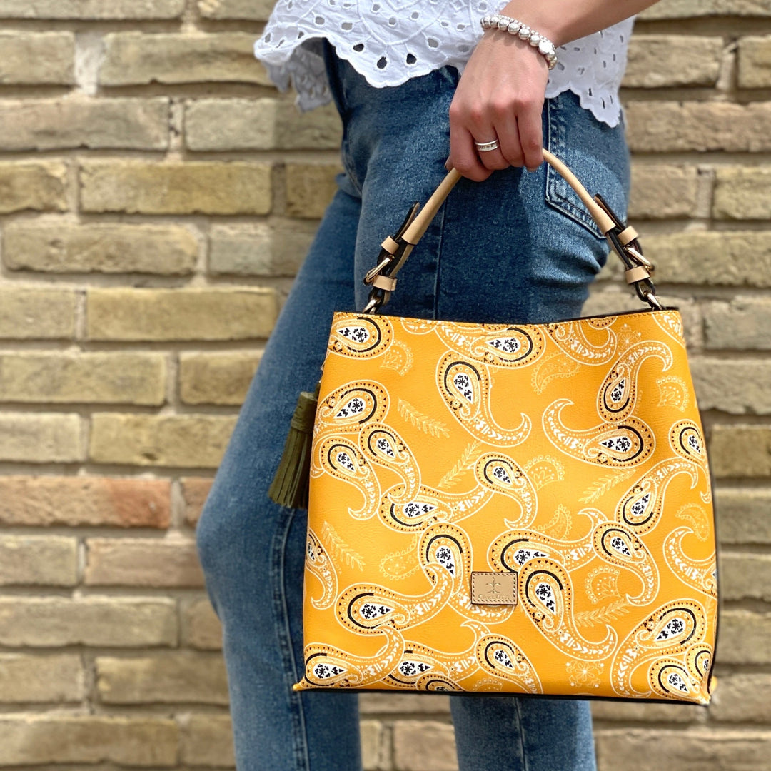 Leather hobo bag with bandana print detail worn on shoulder, artisan Mexican purse with tassel, Bootsologie