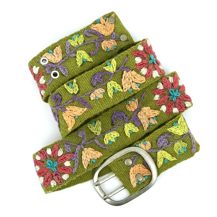 Handmade olive green wool belt from Peru with coral, peach, purple, lime, and turquoise embroidery on clean white background.